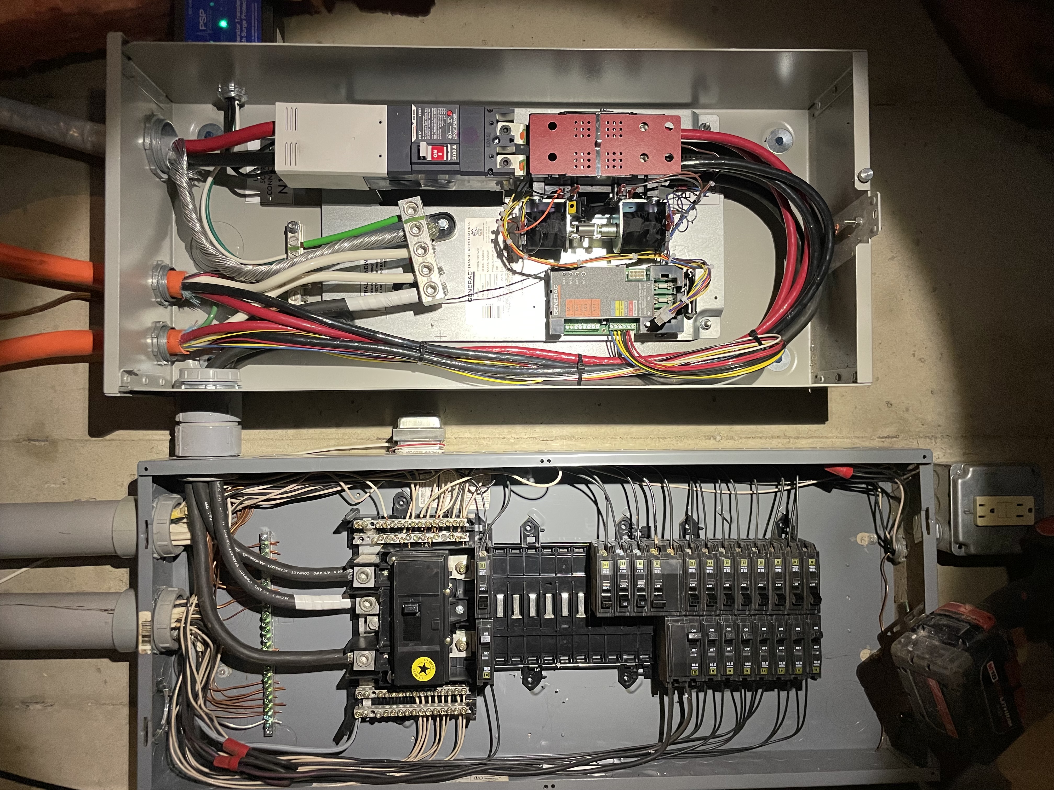 Generac 200A automatic transfer switch wired beside an electrical panel