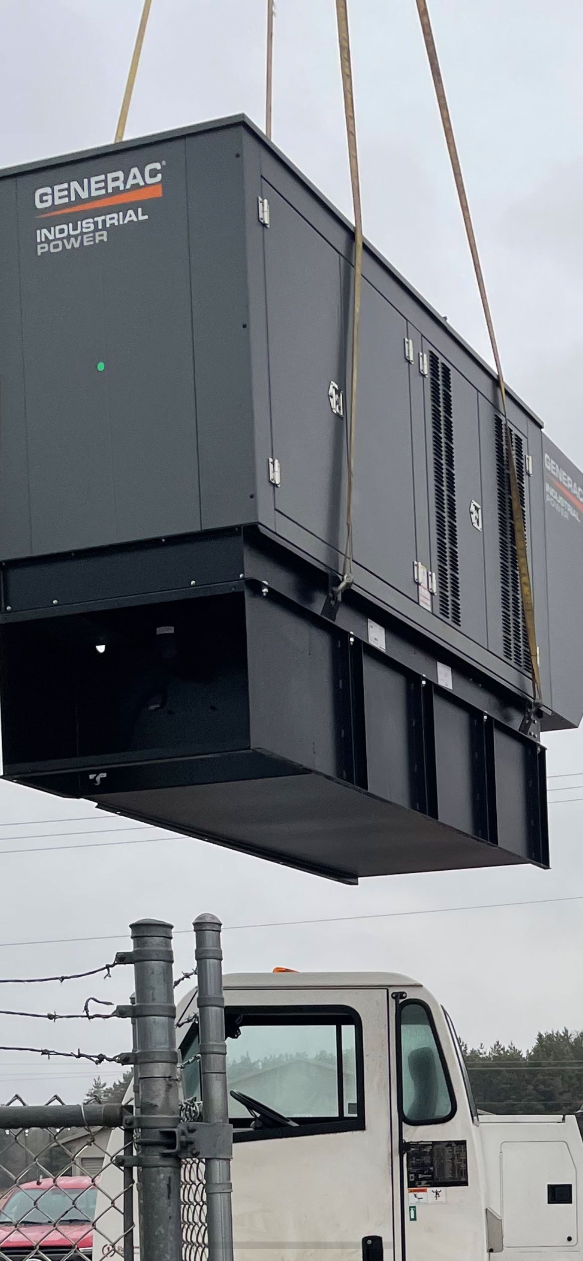 Generac Industrial Power generator suspended from crane rigging