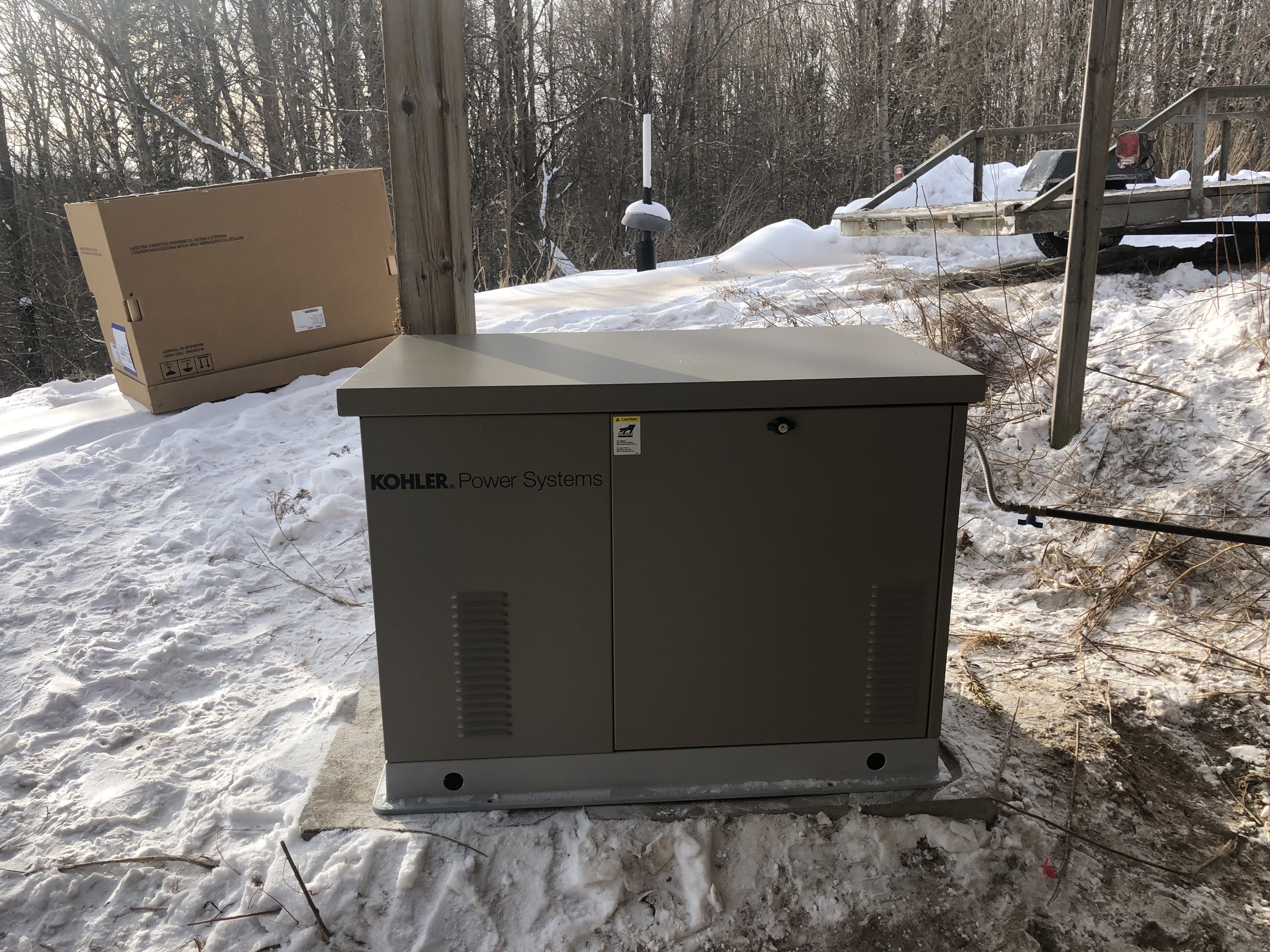 Kohler Power Systems standby generator installed on a snowy site