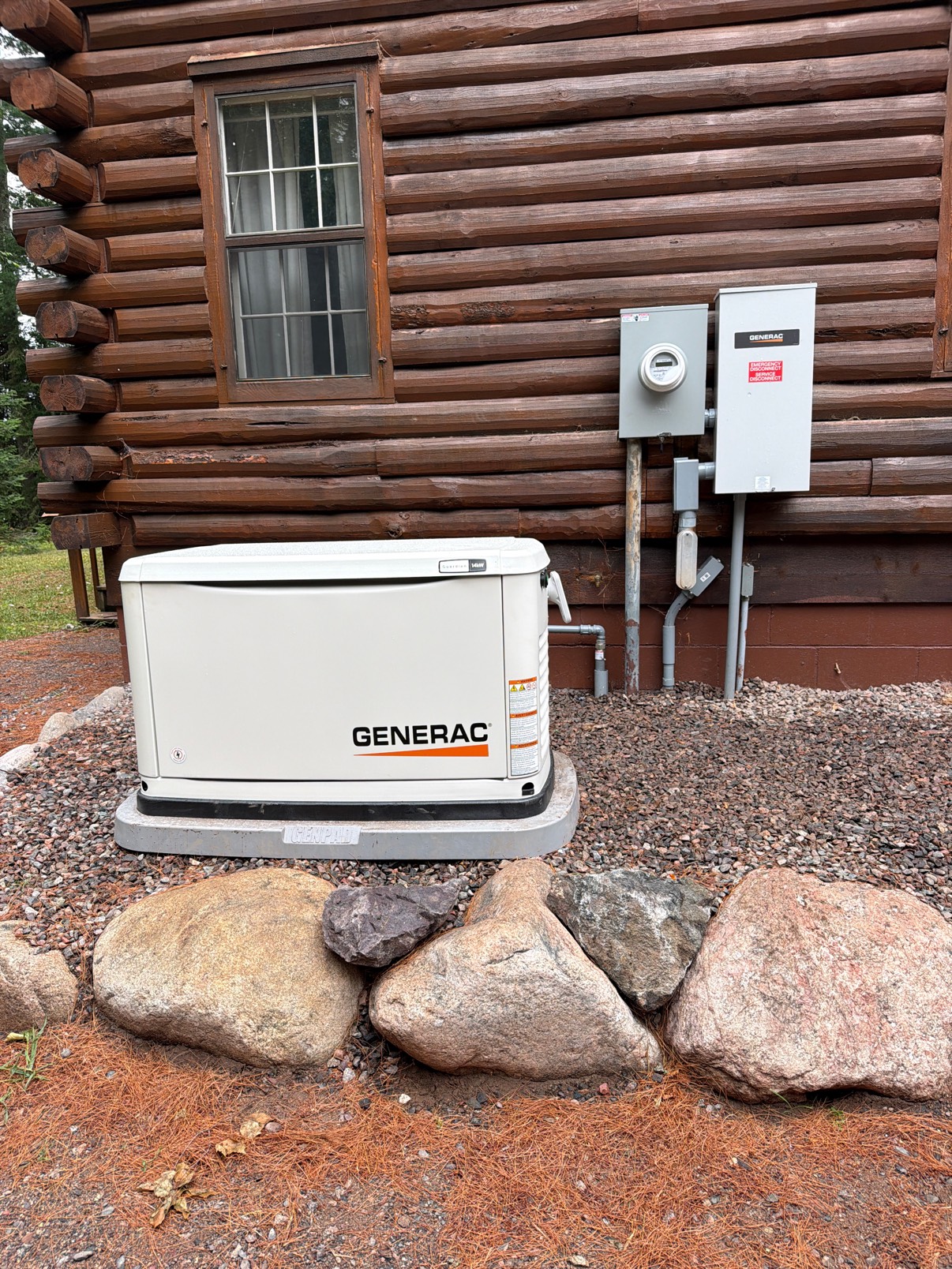 Generac standby generator installed beside a log cabin in Northern Wisconsin